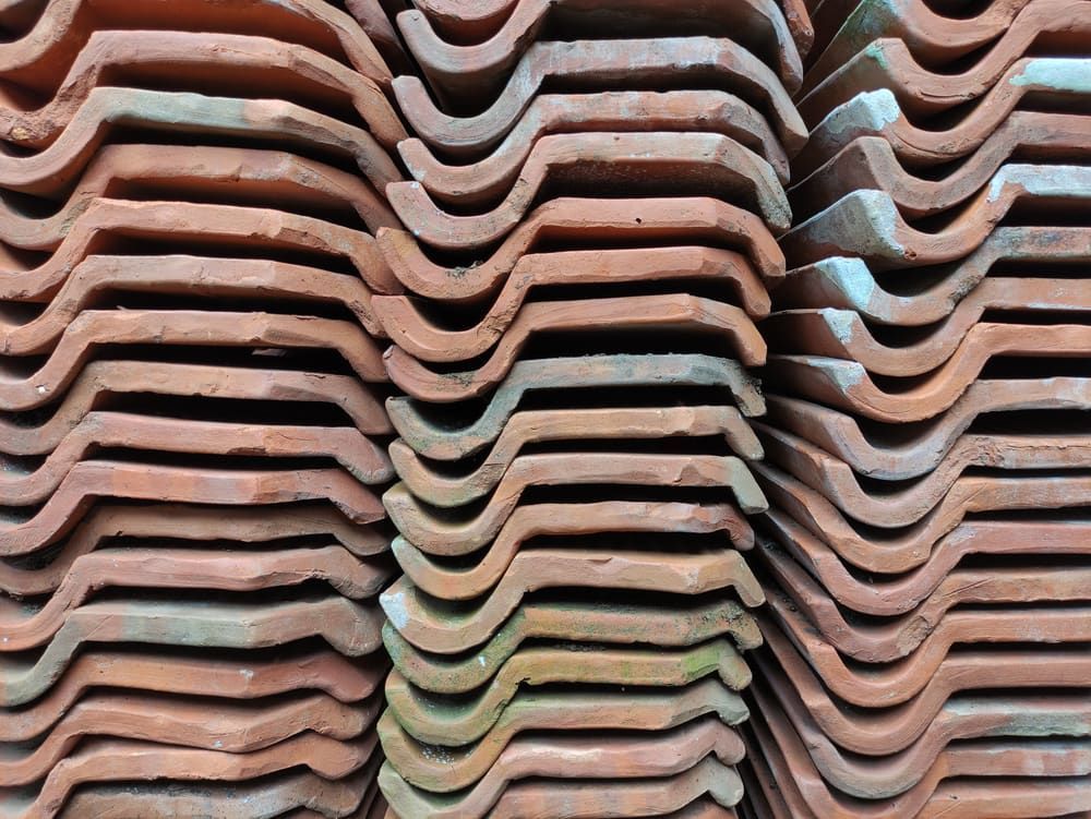 A Close Up Of A Pile Of Roof Tiles Stacked On Top Of Each Other — Mascrete Pty Ltd In Hermit Park, QLD