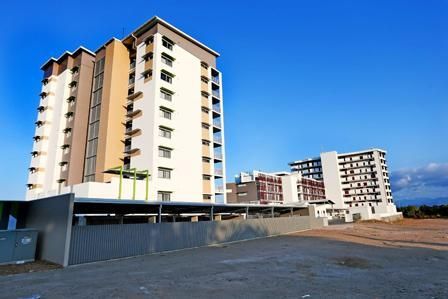 A Large Building With A Lot Of Windows And Balconies — Mascrete Pty Ltd In Hermit Park, QLD