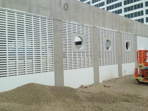 A Concrete Wall With Holes In It Is Being Built — Mascrete Pty Ltd In Hermit Park, QLD