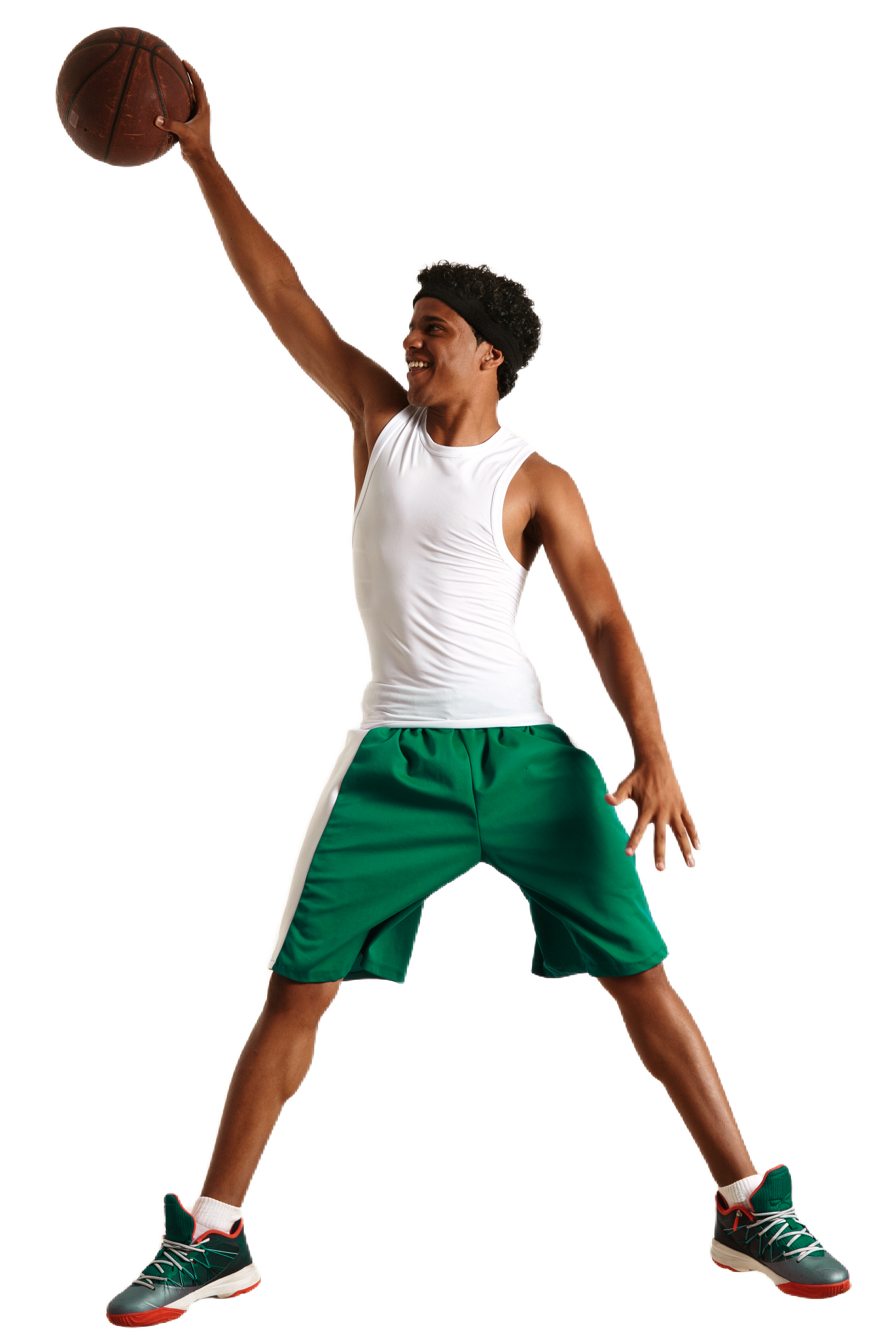 Basketball player in green shorts, white tank top, headband, jumping, about to shoot, holding ball.