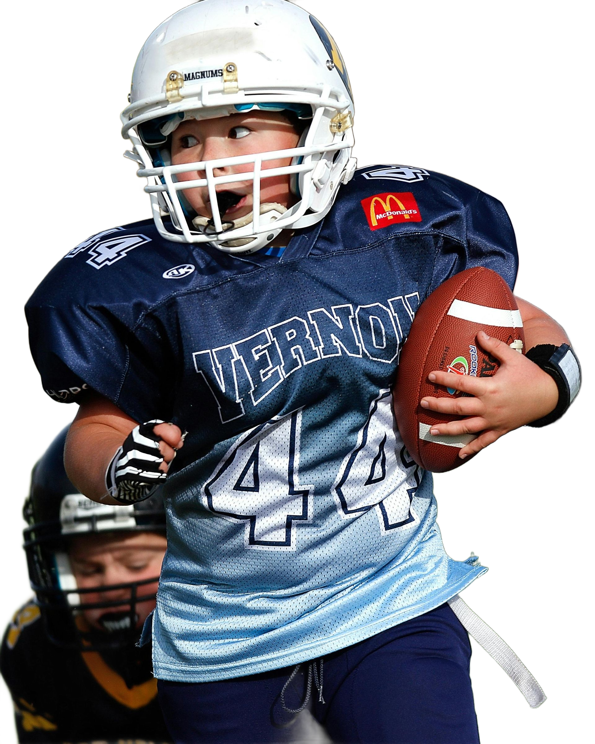 Youth football player runs with the ball, wearing a blue jersey, and a helmet.