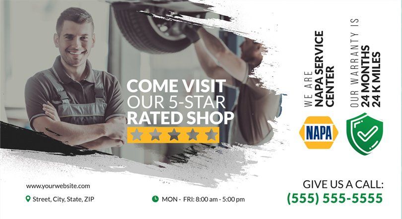 A man is working on a car in a napa service center.