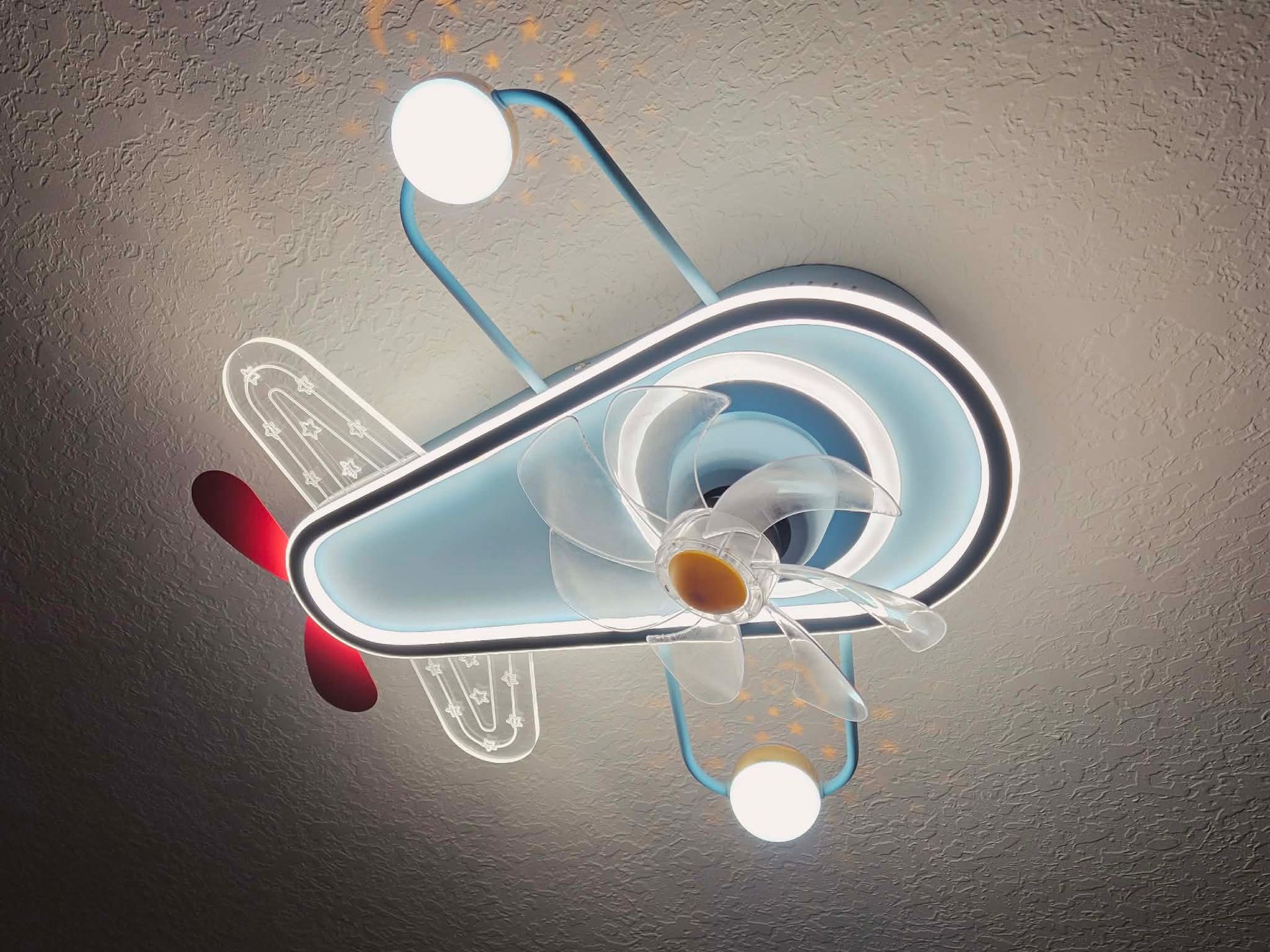 Abstract blue and white 3D megaphone with red accents and glowing circles on a gray background