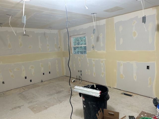 A large empty room in a house under construction.