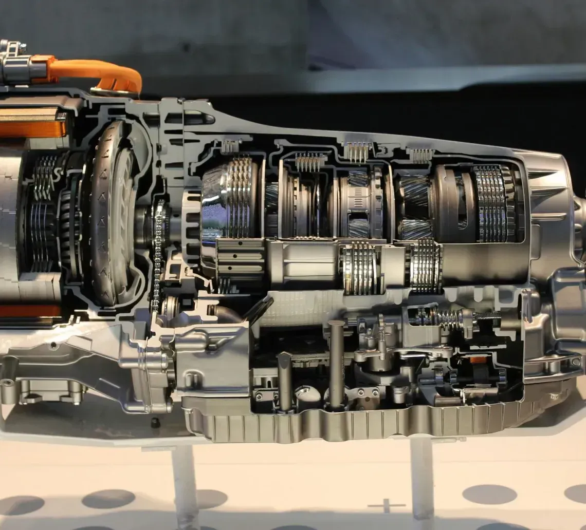 Cutaway view of an automatic transmission showcasing internal components, various gears, and housing.