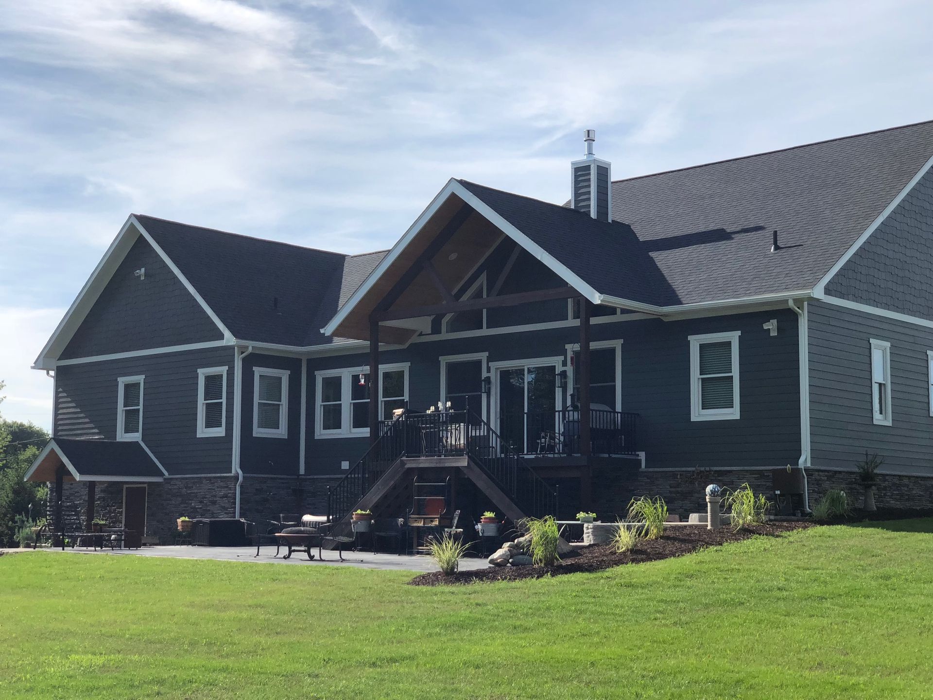 A large house with a large lawn in front of it