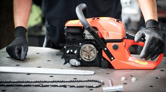 Auto Mechanic Working on Engine — Nitro, WV — Nitro Lawn Mower & Chain Saw Co