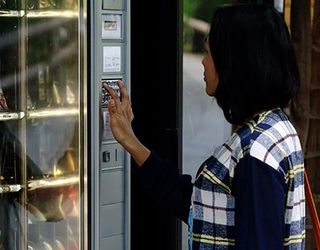 Woman Using Vending Machine - Vending Machine Merchandise in Silver Spring, MD
