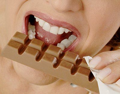 Woman Eating Chocolate - Vending Machine Parts & Supplies Wholesale & Manufacturers in Silver Spring, MD