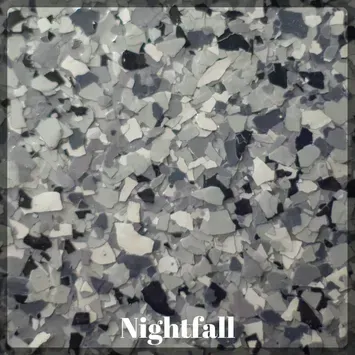 A close up of a gray , white , and black marble floor.