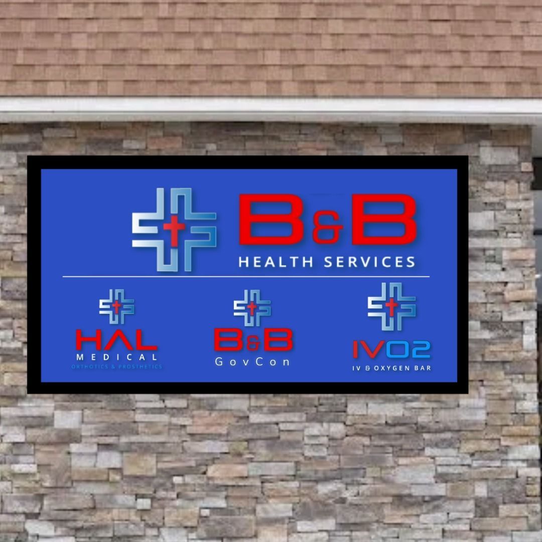 A b & b health services sign hangs on a stone wall