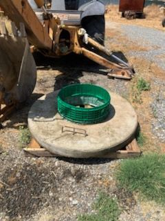 Family gathered at a dining table in a kitchen. They are eating and talking together.