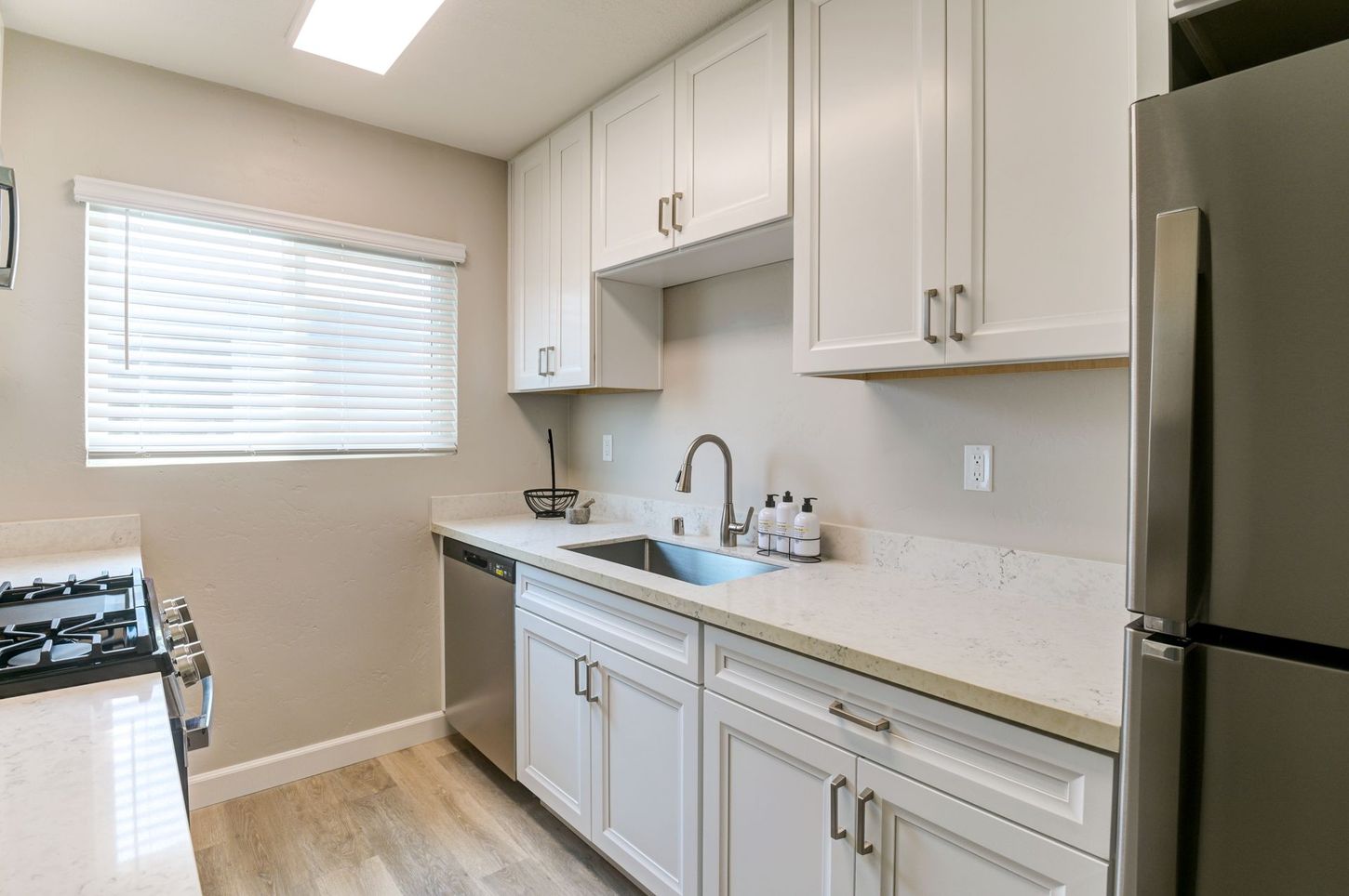 photo showing the kitchen with some natural lighting