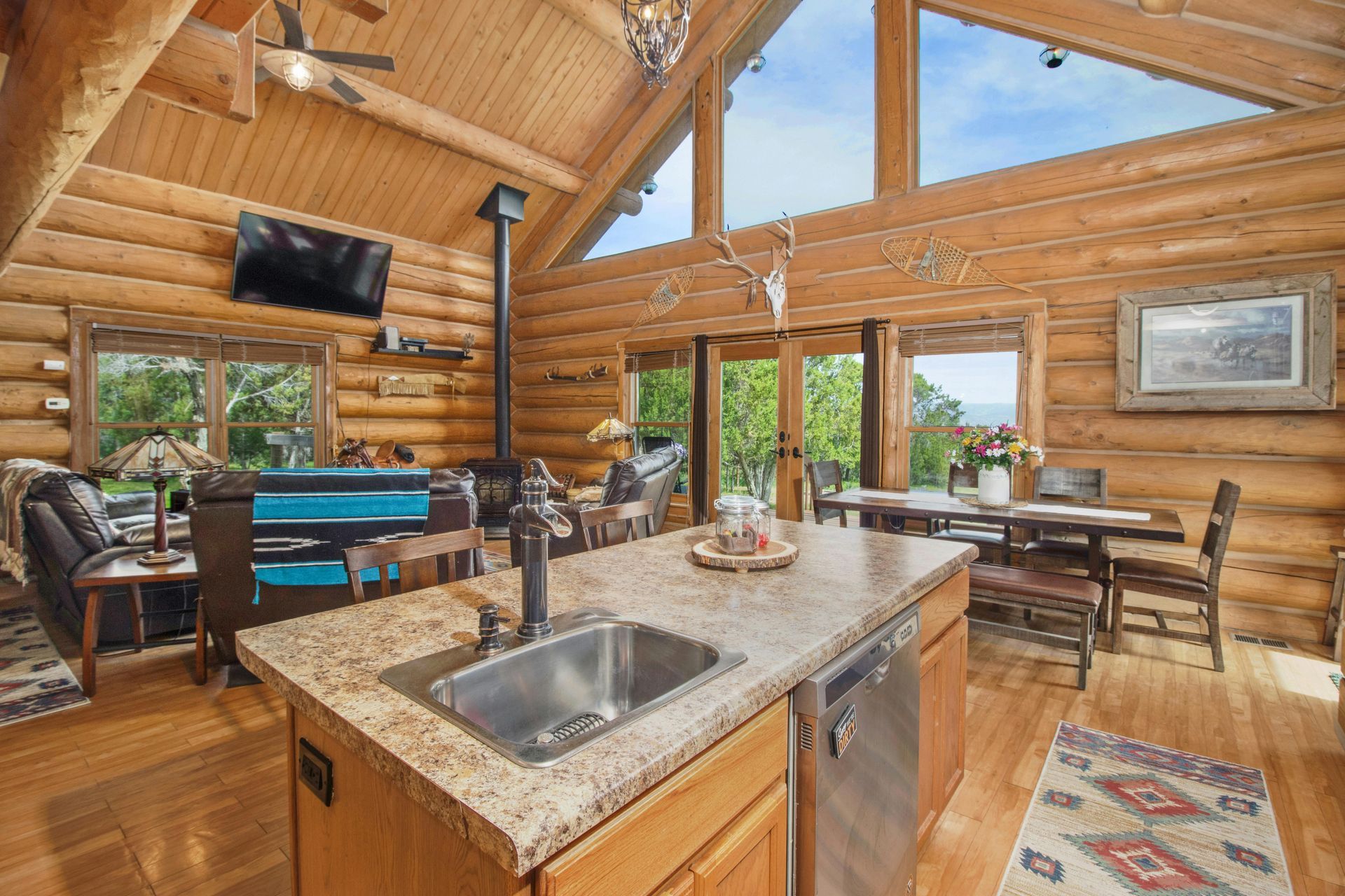 A kitchen with a large island in the middle of it.