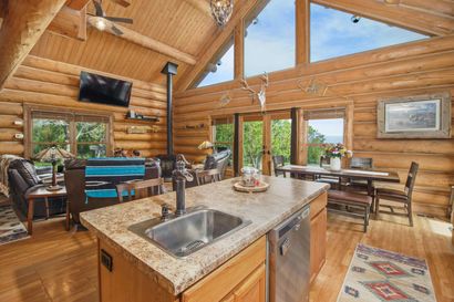 A kitchen with a large island in the middle of it.
