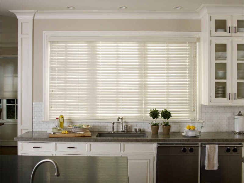 A kitchen with white cabinets and stainless steel appliances Love is Blinds Arizona (844) 936-2446