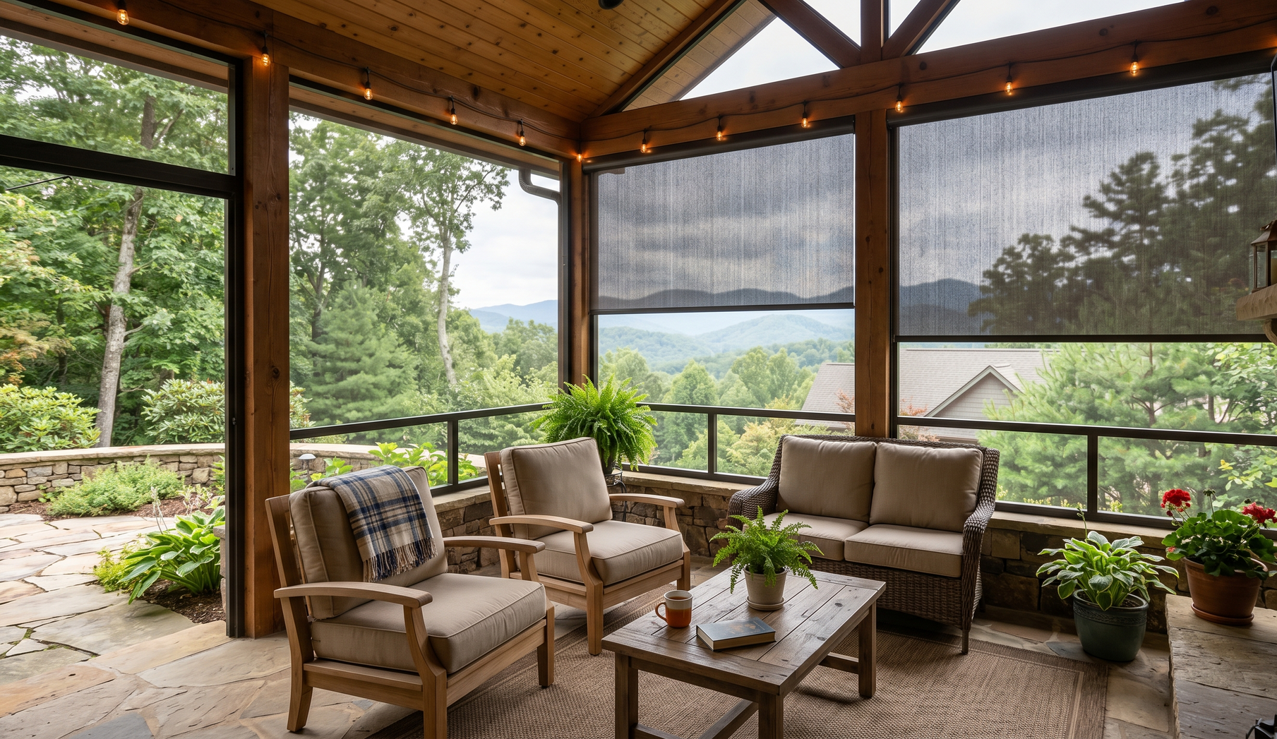Covered patio with exterior patio shades,wicker chairs, coffee table, and mountain views through screened openings.