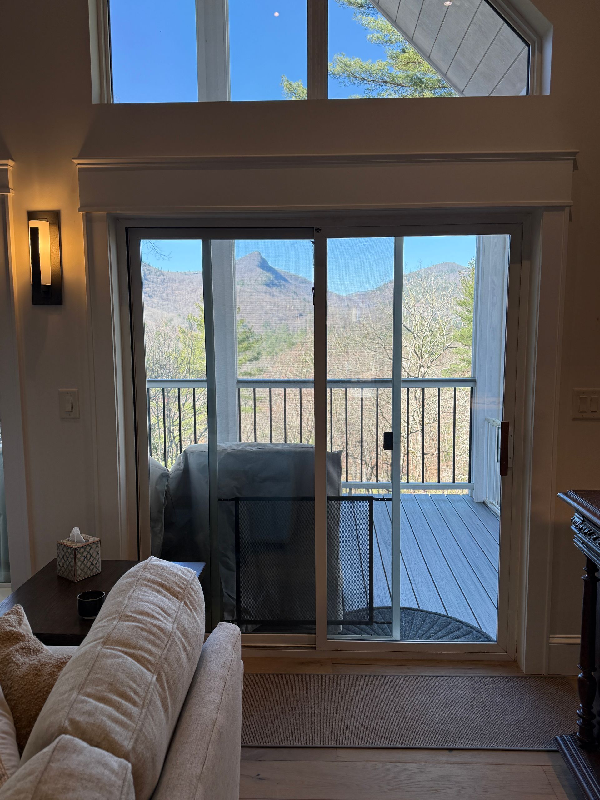 Before: bare sliding glass door with no window treatment in mountain home living room, Sapphire NC