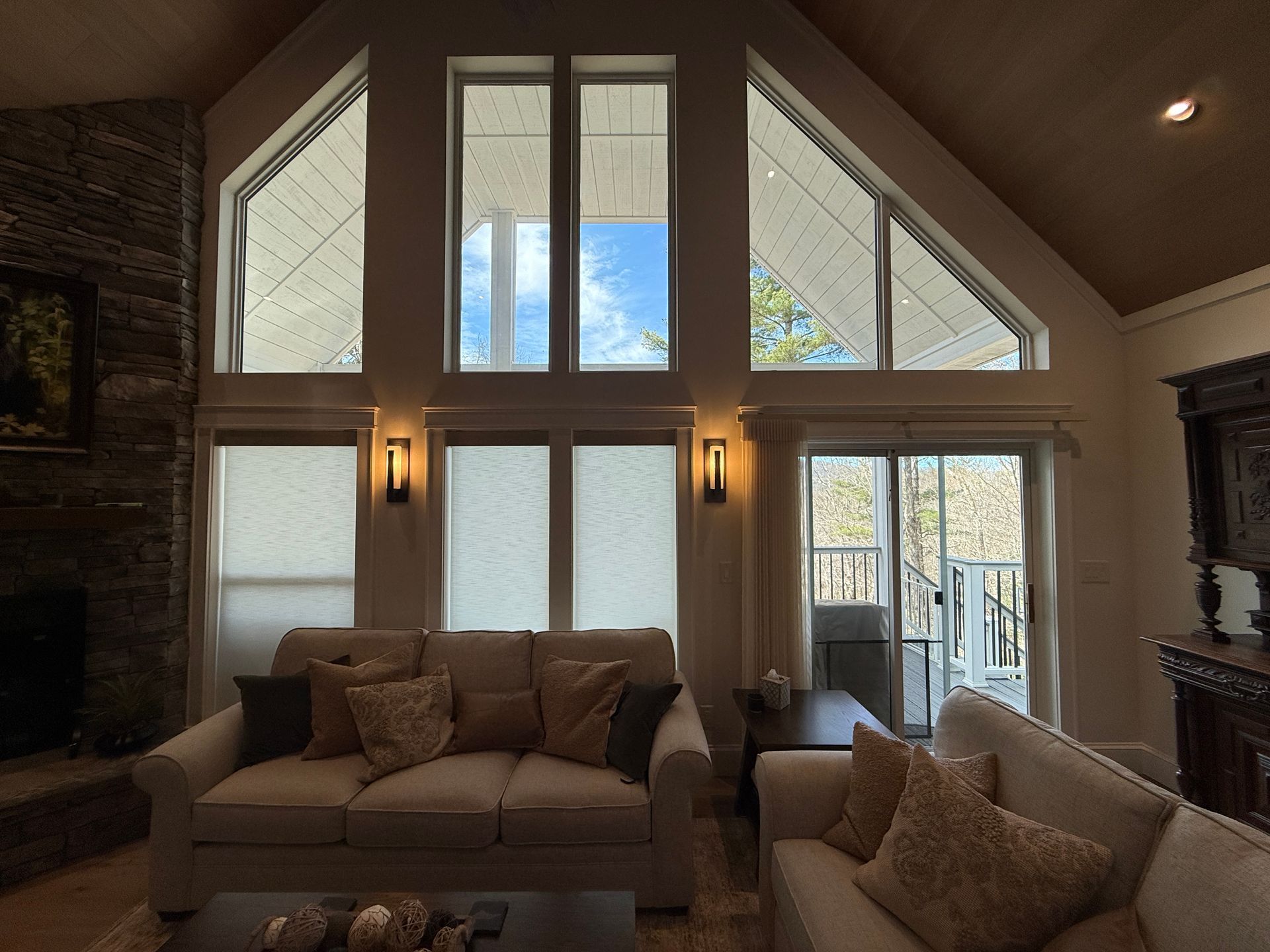 Norman® SmartDrapes® open with roller shades closed on casement windows — Sapphire NC great room window treatment installation