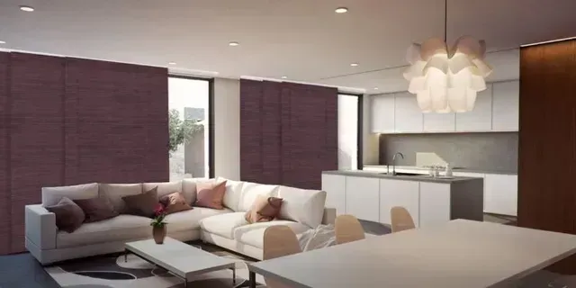A living room with a couch , table and chairs and a kitchen. Love is Blinds Arizona (844) 936-2446