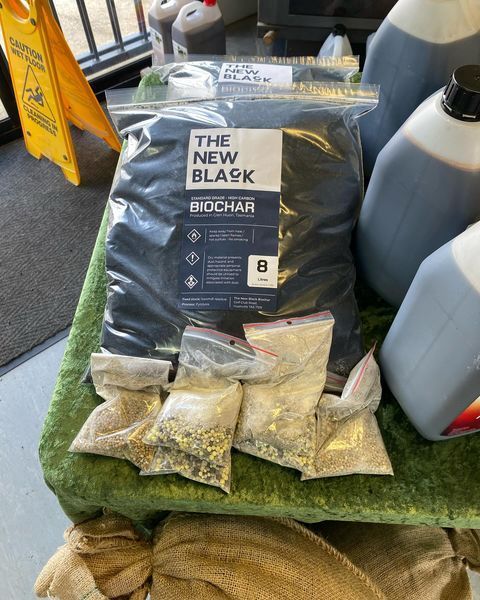 A bag of the new black sits on a table