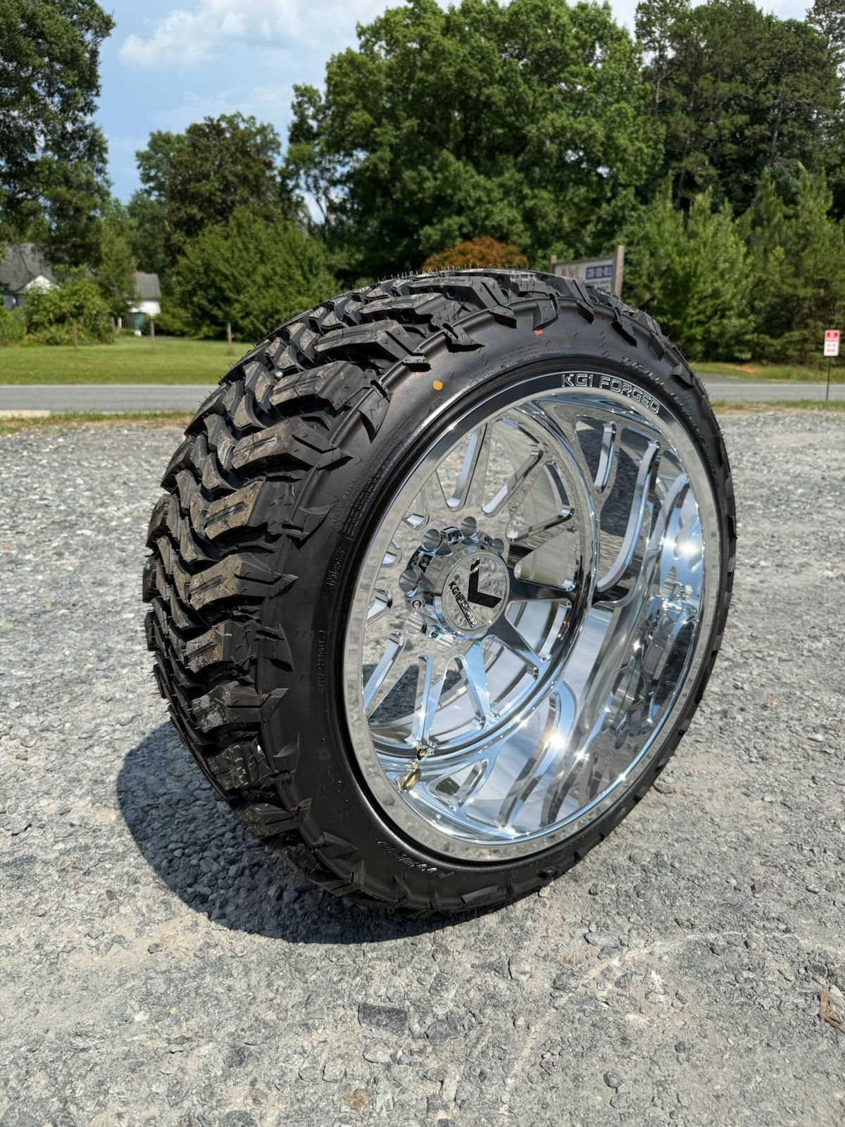 Black and silver truck wheel with a thick, rugged tire.