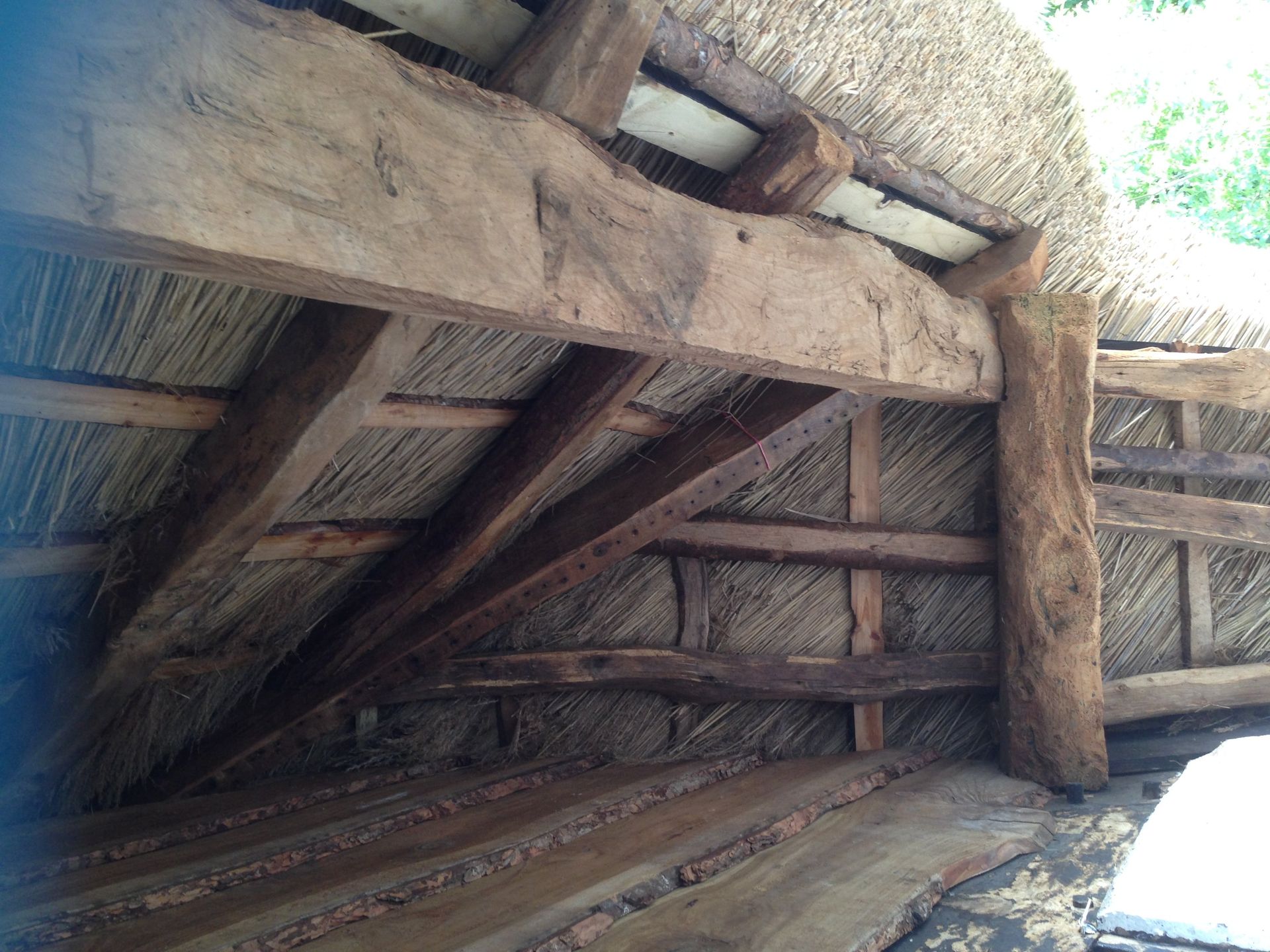 inside of thatched roof repair by RTB construction in Cheltenham
