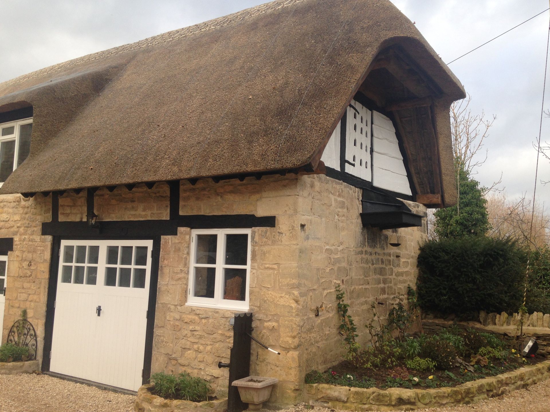 view of thatched roof repair by RTB construction in Cheltenham