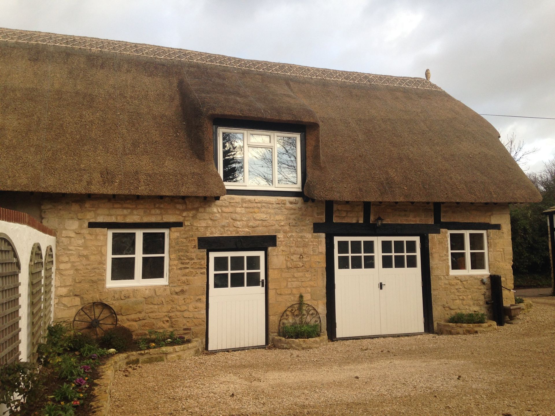 completed thatched roof repair by RTB construction in Cheltenham