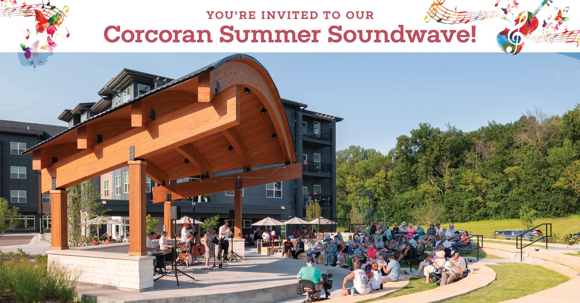 Watercolor rendering of a four-story apartment complex with blue, tan, and brown siding and a central courtyard.
