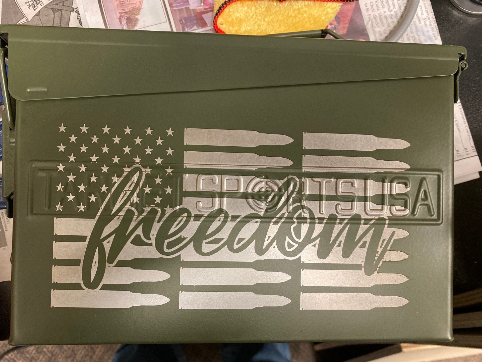 A green box with an american flag and the word freedom on it.
