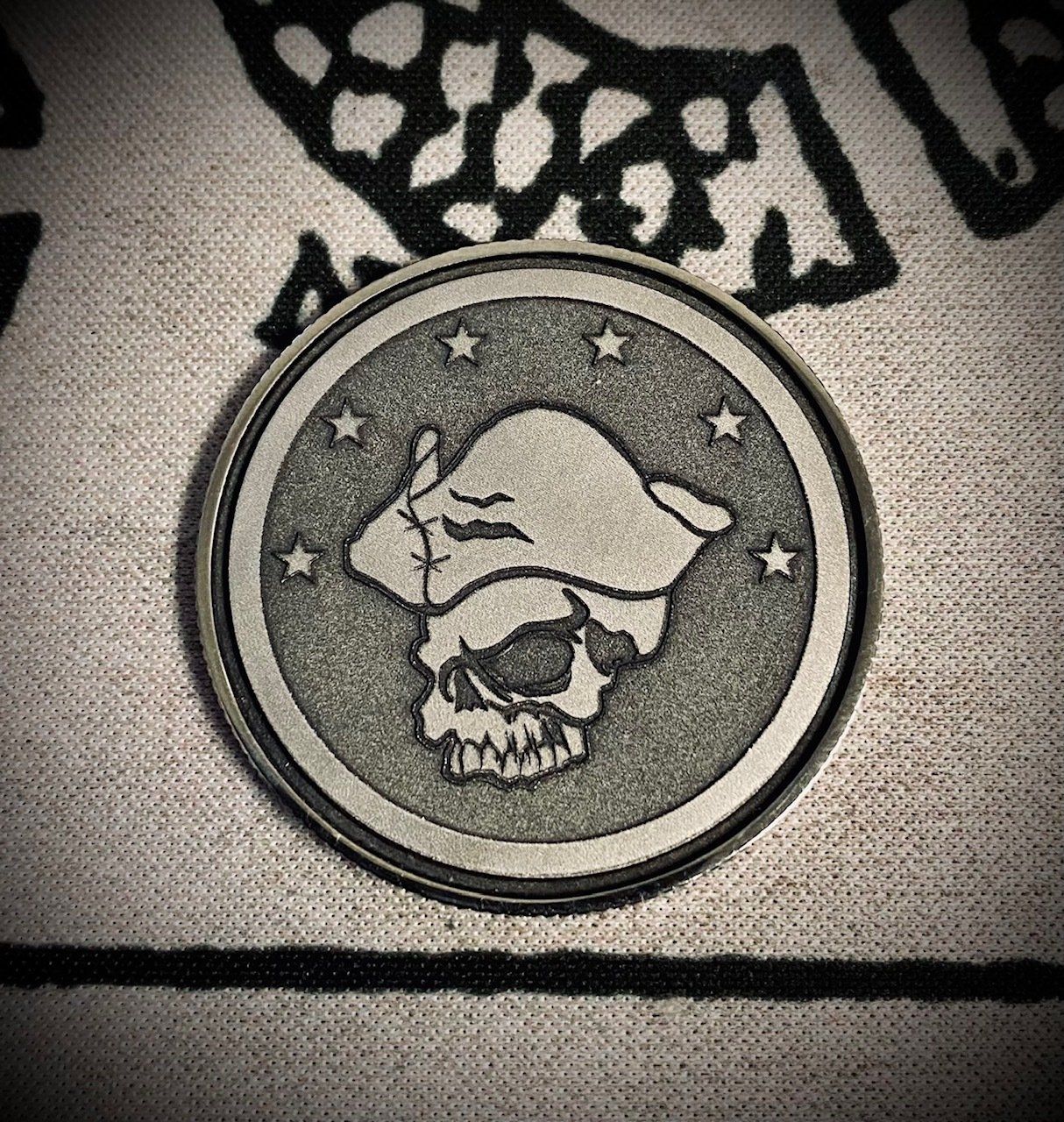 A coin with a skull and stars on it