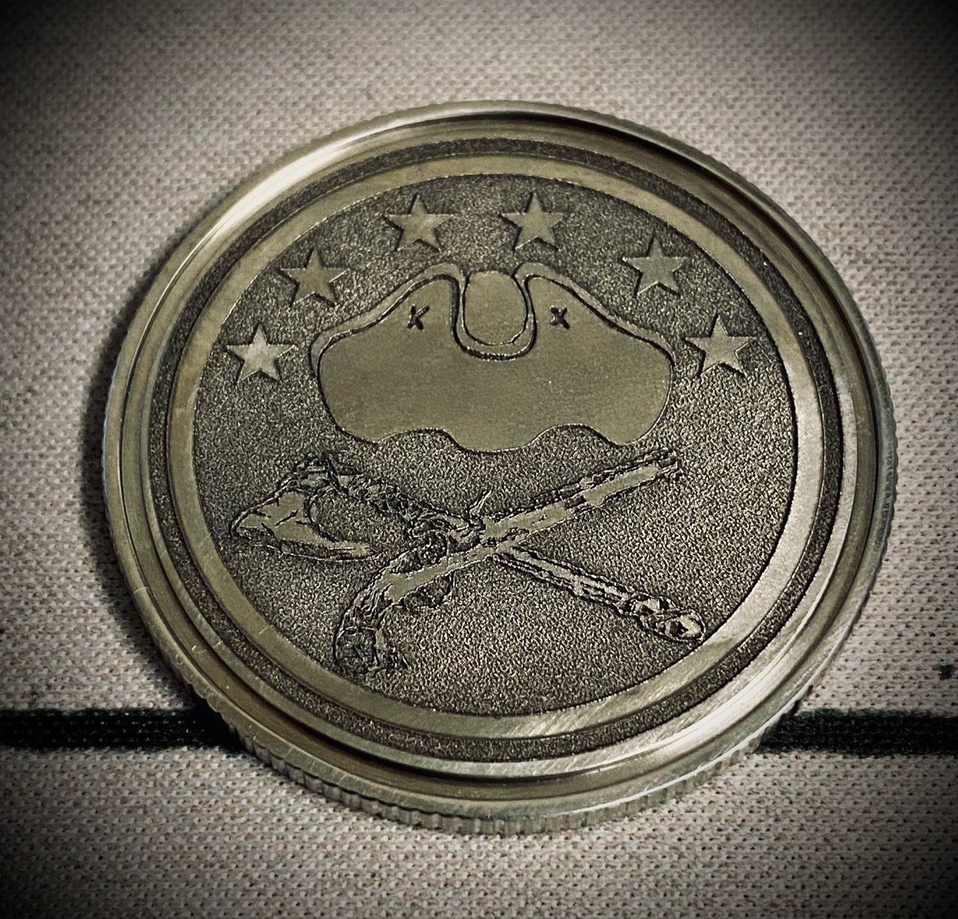 A coin with a skull and crossbones on it