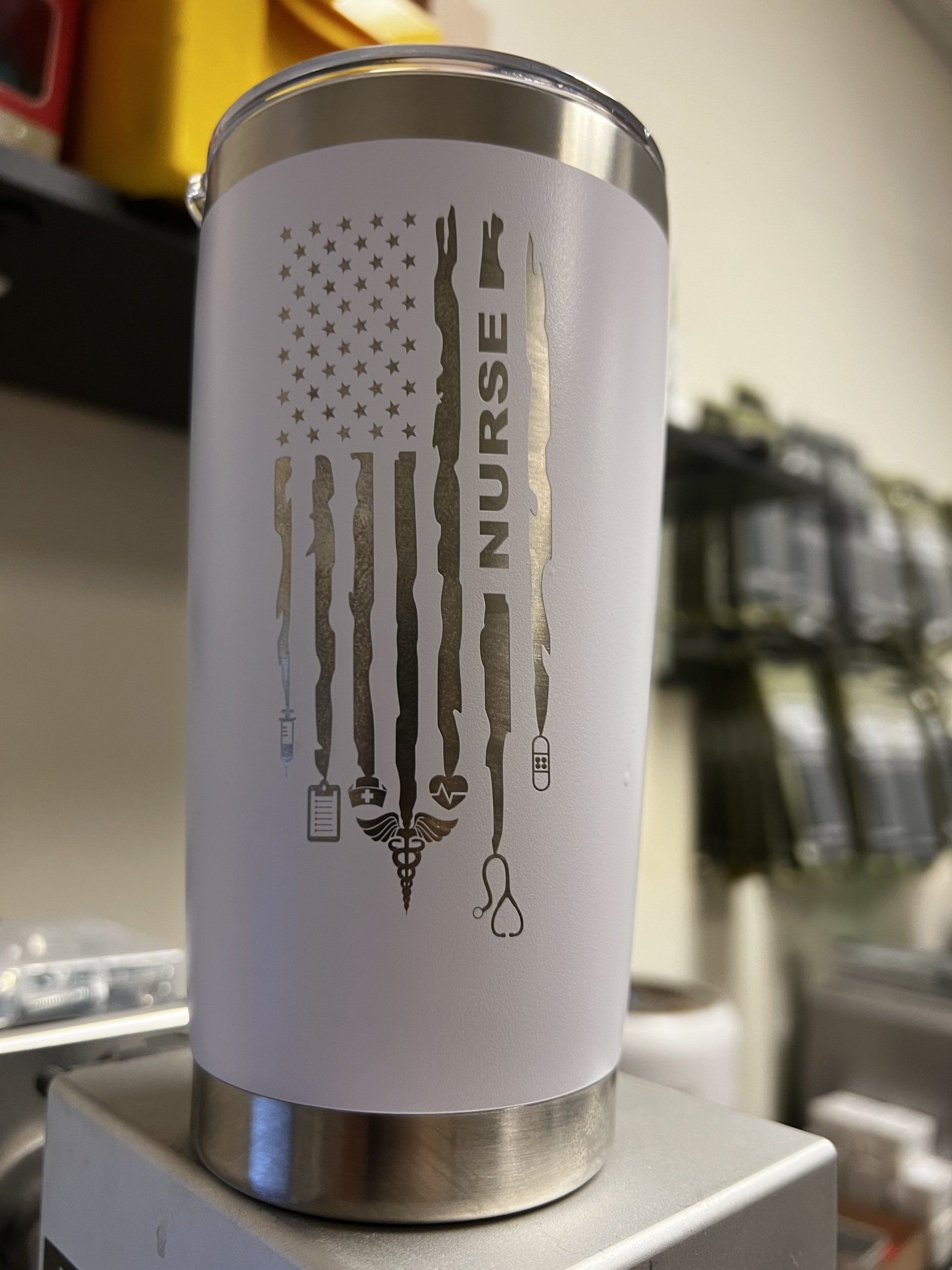 A nurse tumbler with an american flag on it