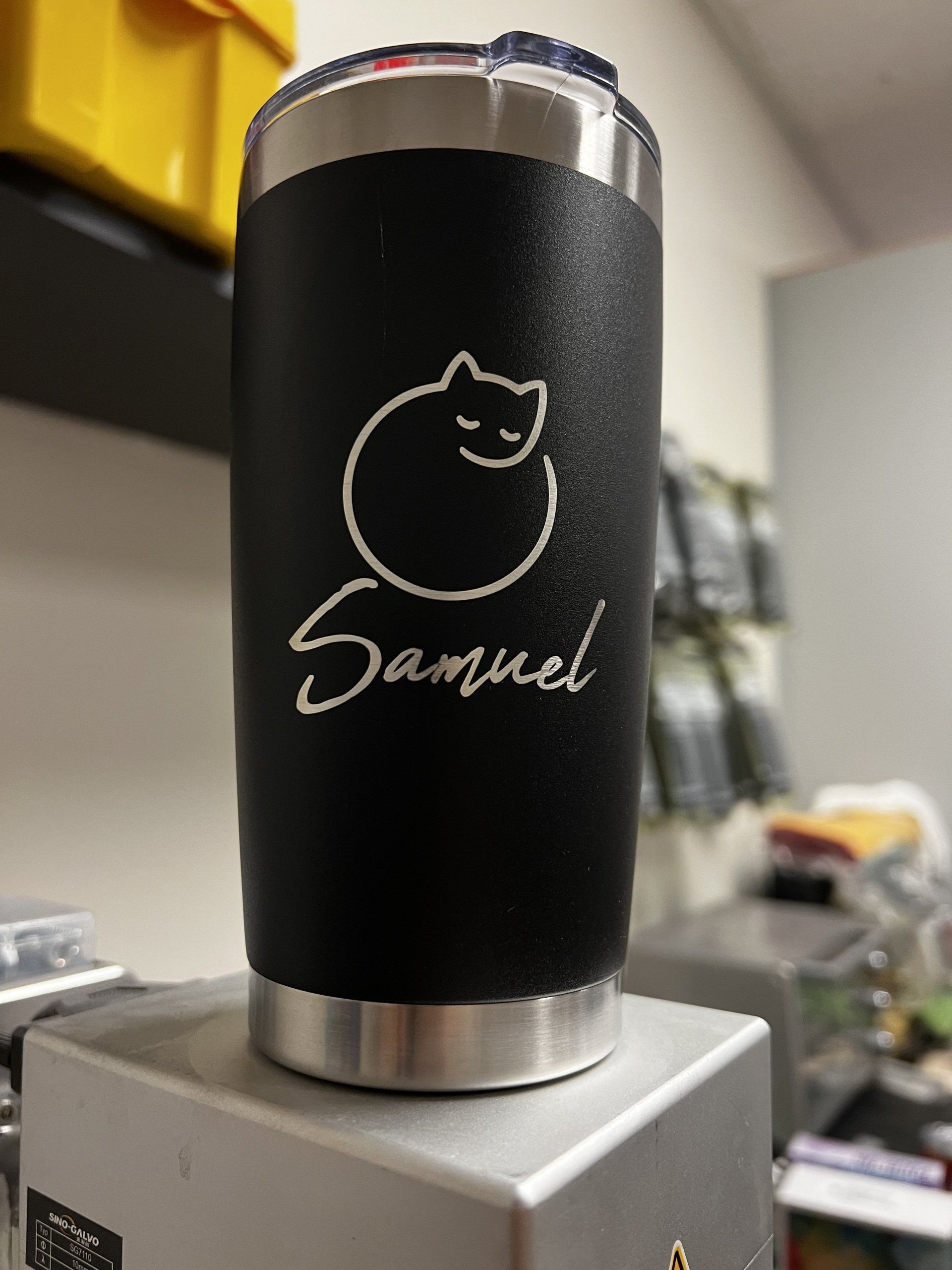 A black tumbler with the name samuel on it