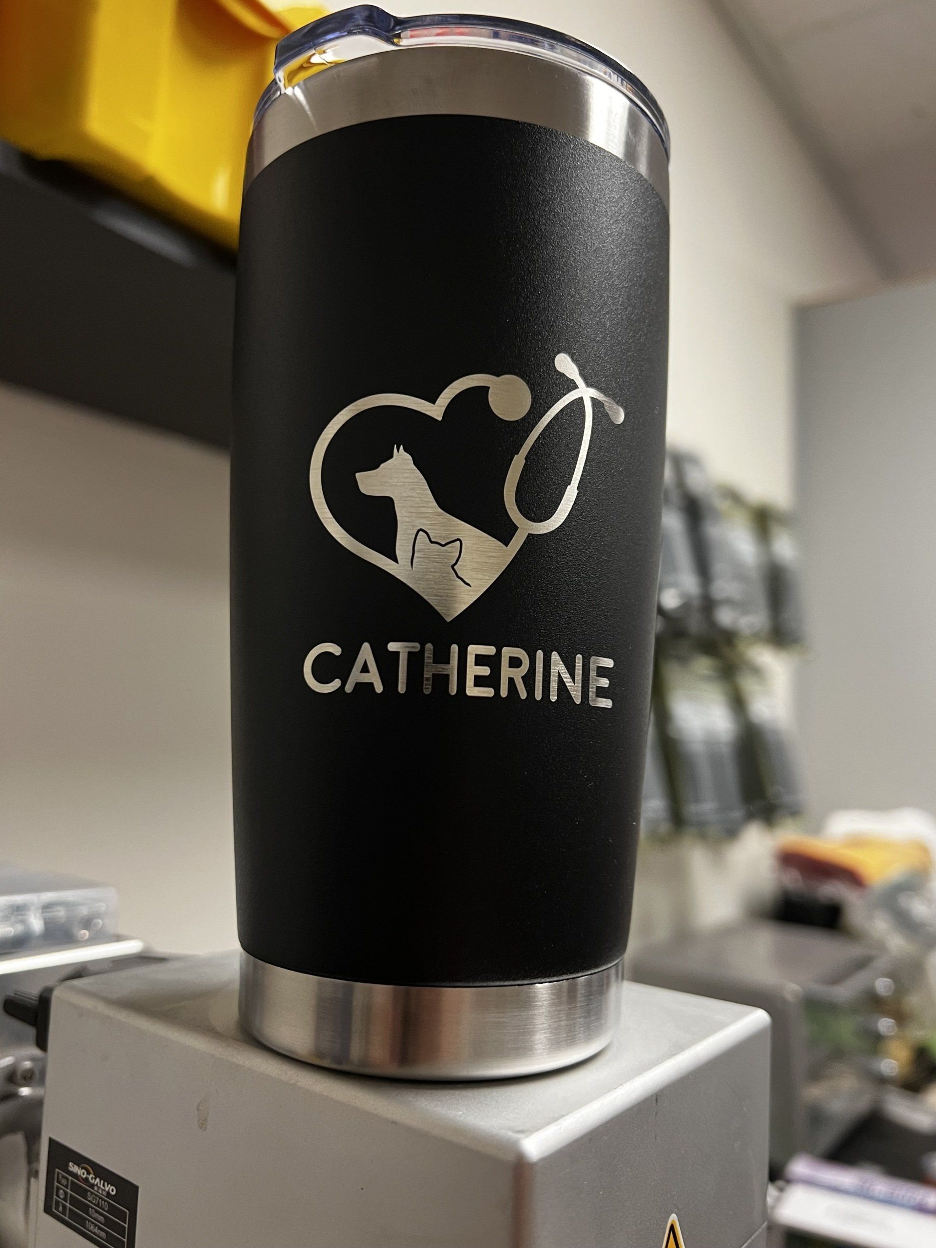 A black tumbler with the name catherine on it