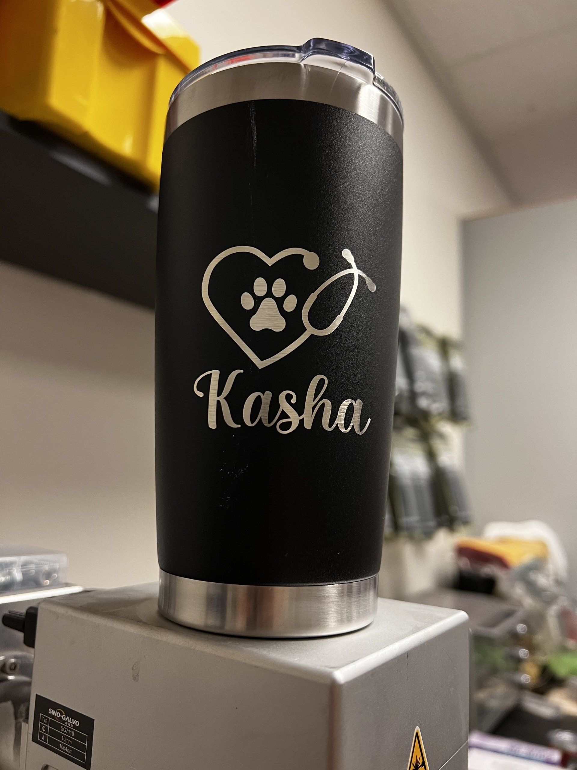 A black tumbler with the name kasha on it