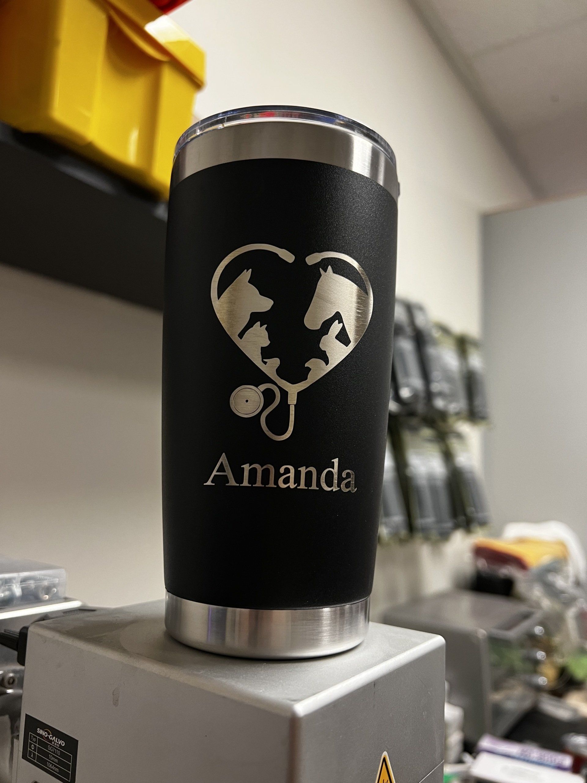 A black tumbler with the name amanda engraved on it