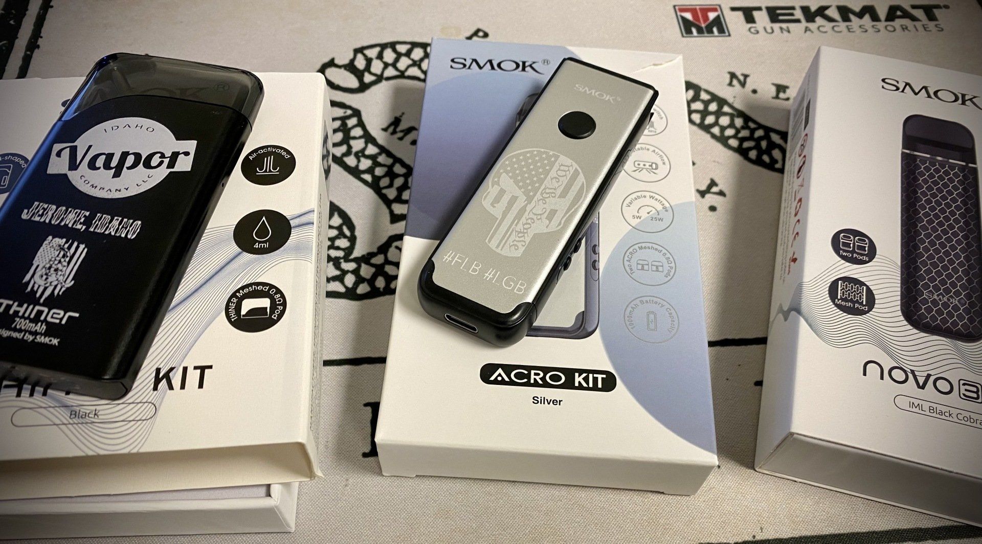 Several boxes of electronic cigarettes are stacked on top of each other