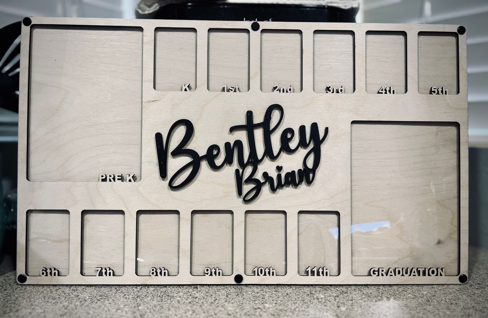 A wooden board with bentley brian written on it