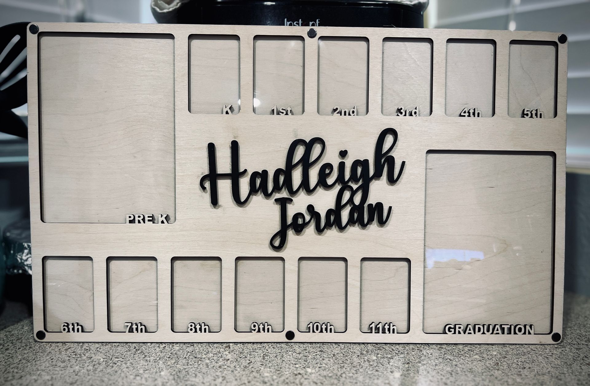 A wooden board with the name hadleigh jordan on it