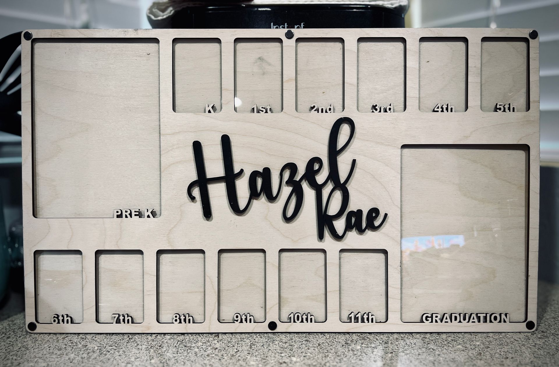 A wooden sign with the name hazel rae on it