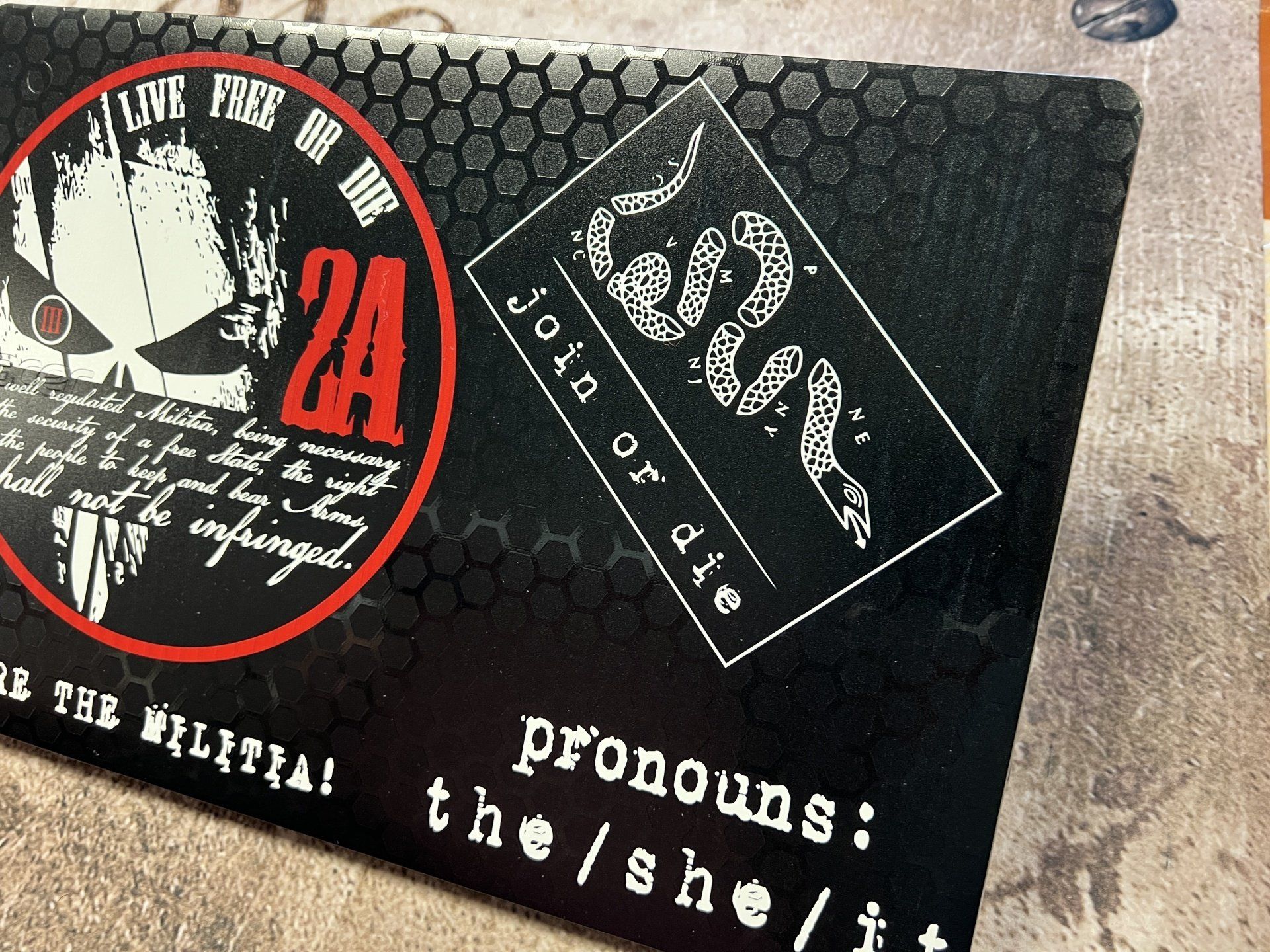 A business card with a skull and the number 24 on it