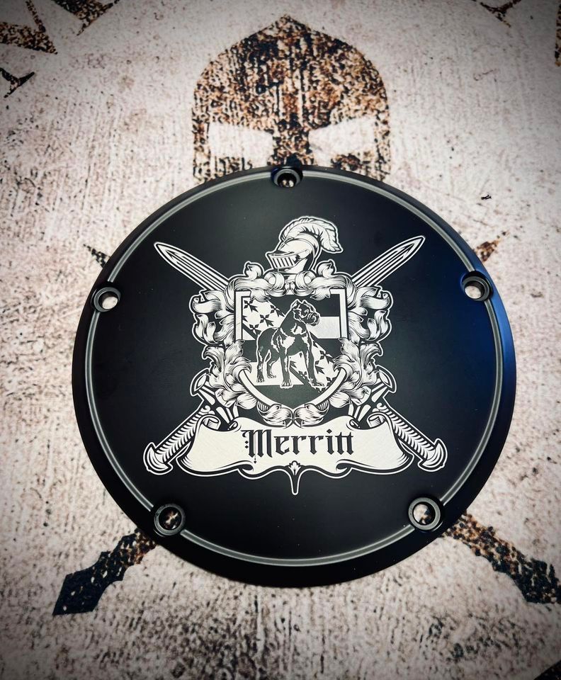 A black emblem with the name merrin on it
