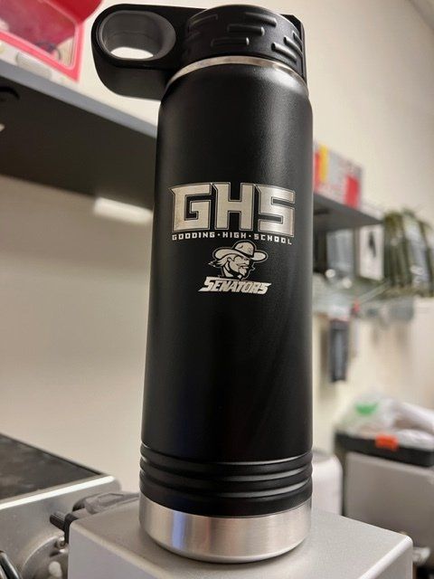 A black water bottle with ghs written on it