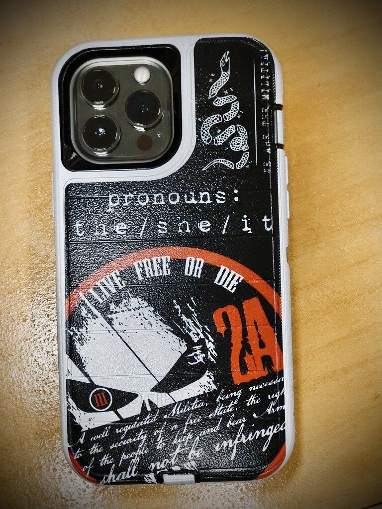 A phone case with the number 24 on it is sitting on a wooden table.