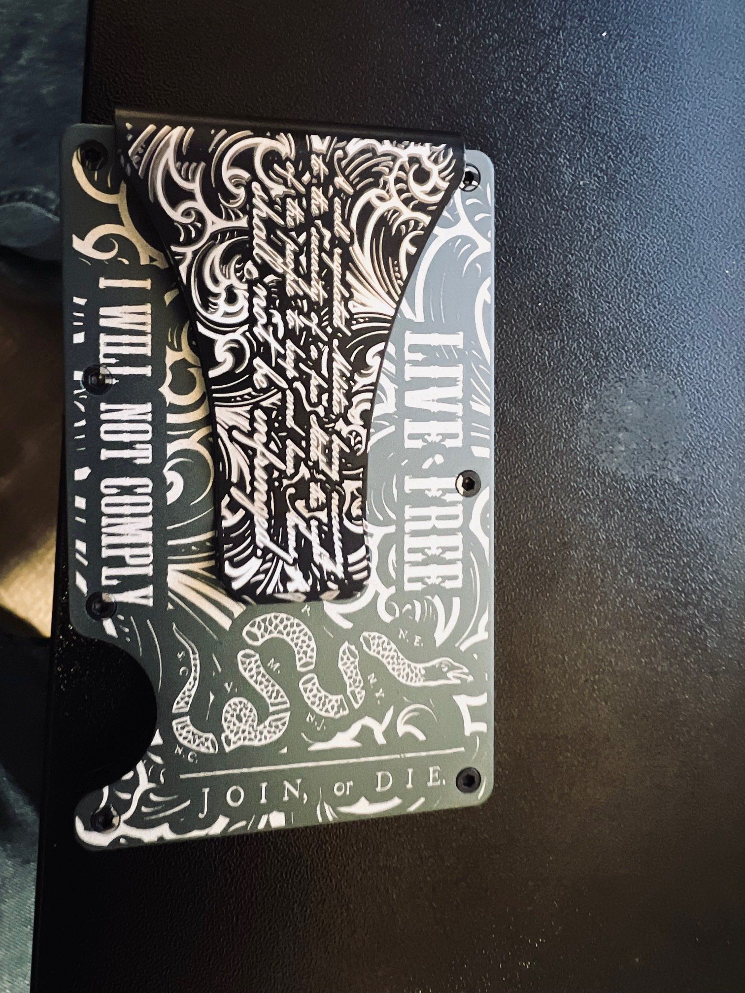 A wallet that says i will not comply on it