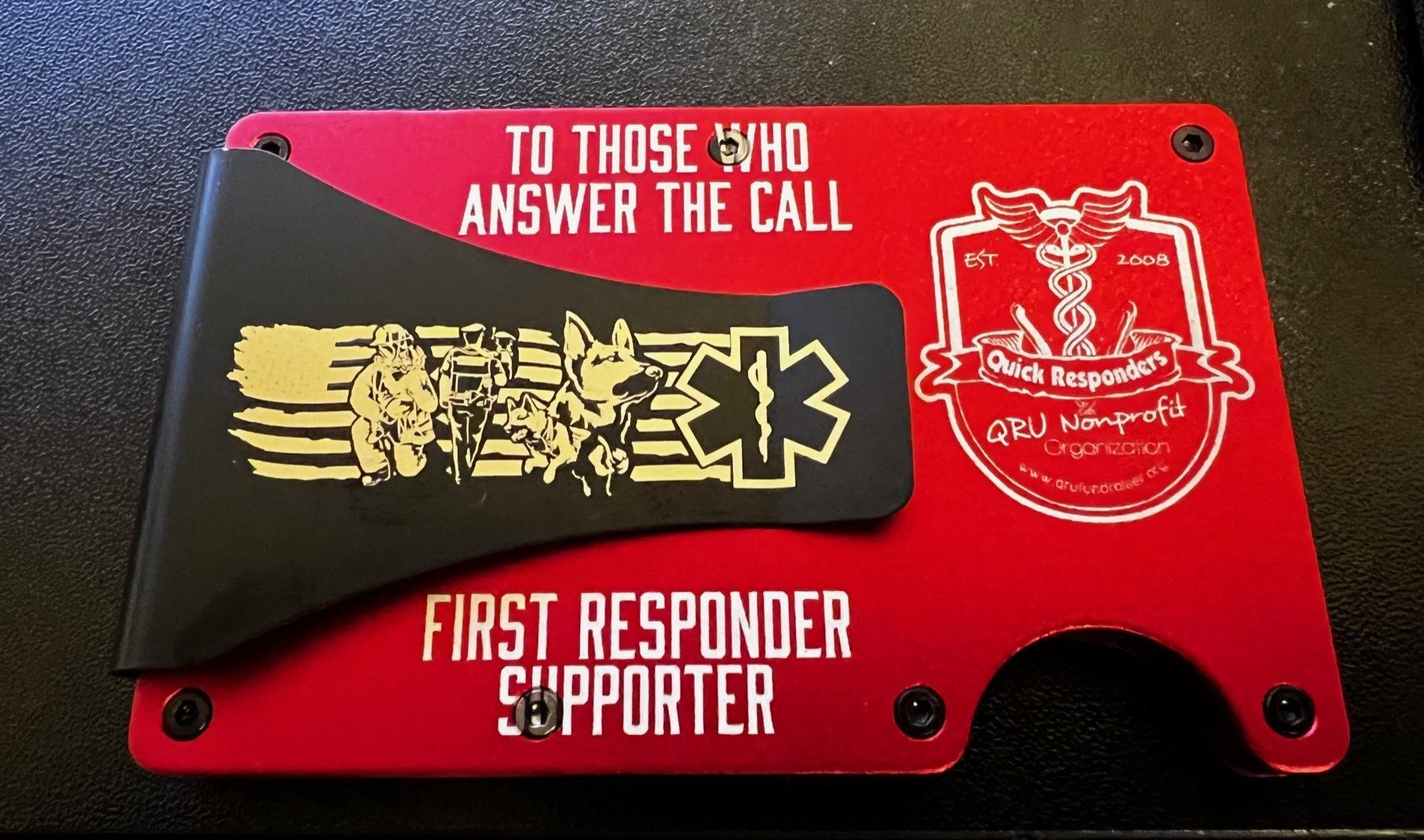 A red wallet that says to those who answer the call first responder supporter