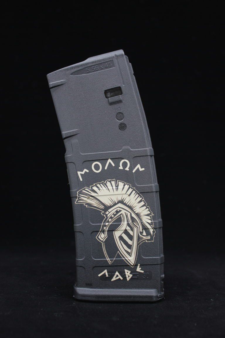 A black magazine with a picture of a spartan helmet on it.