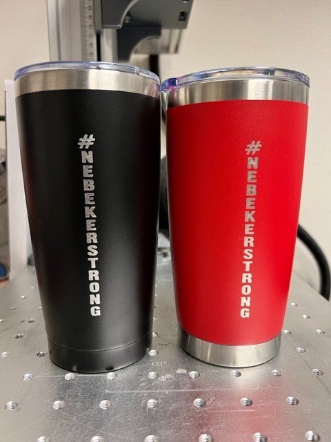 Two stainless steel tumblers that say #nebekerstrong